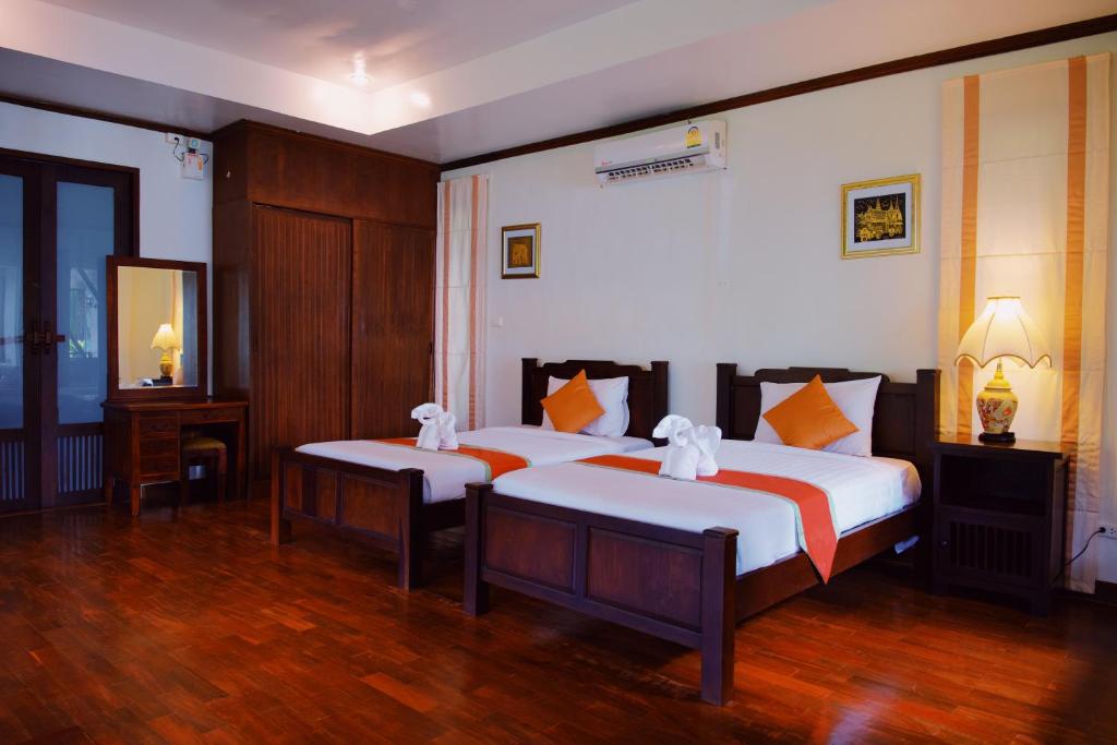 Postel nebo postele na pokoji v ubytování Kooncharaburi Resort - Koh Chang