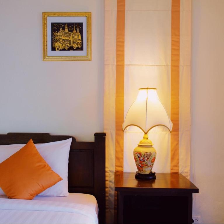 Postel nebo postele na pokoji v ubytování Kooncharaburi Resort - Koh Chang