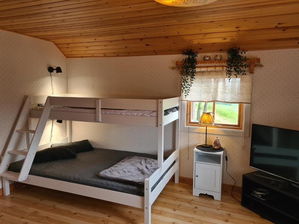 Postel nebo postele na pokoji v ubytování GUNNAN