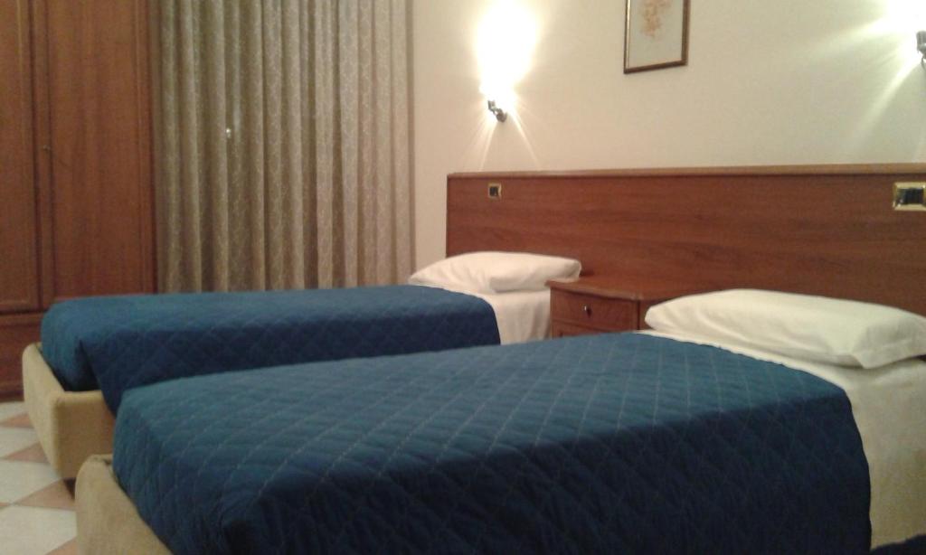 Postel nebo postele na pokoji v ubytování Casa Hellen