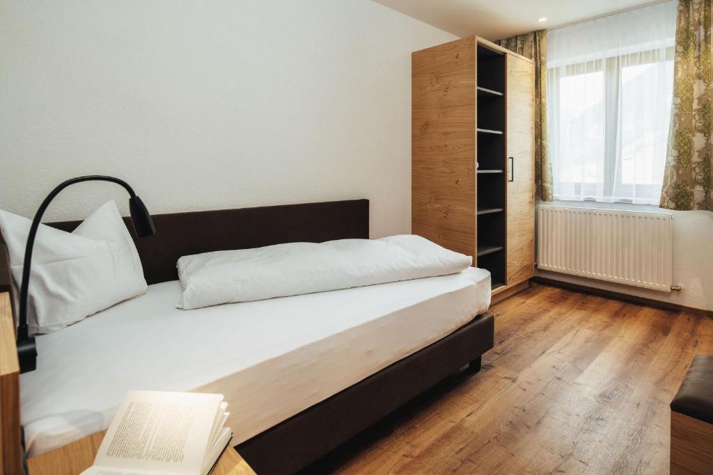 Posteľ alebo postele v izbe v ubytovaní Hotel Edelweiss Superior