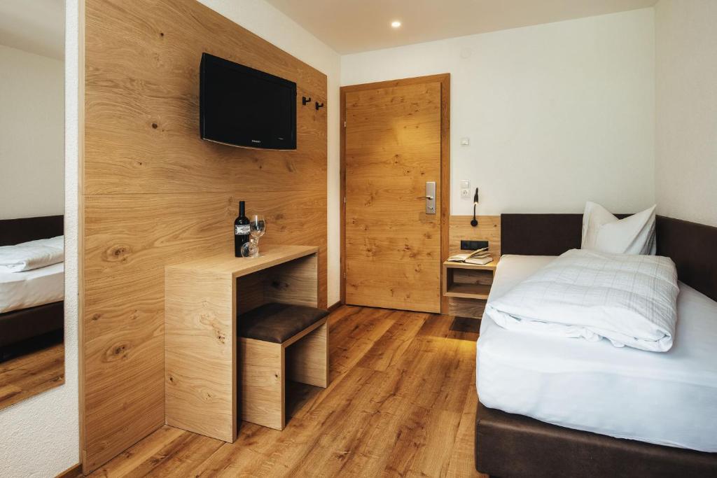 Posteľ alebo postele v izbe v ubytovaní Hotel Edelweiss Superior