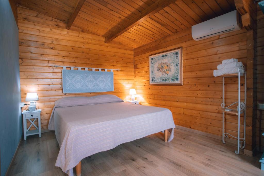 Postel nebo postele na pokoji v ubytování Chalet Sa Petra Ruja - Gadu e Tremene