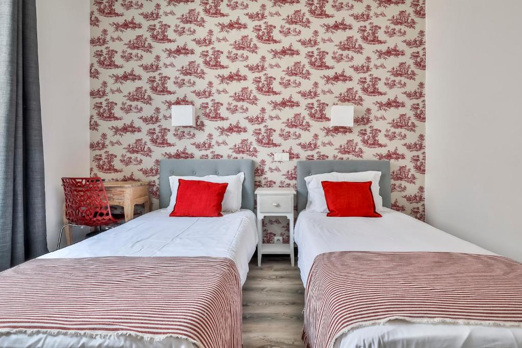 Postel nebo postele na pokoji v ubytování Hôtel Parc Mazon-Biarritz