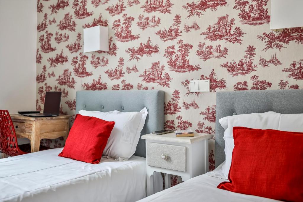 Postel nebo postele na pokoji v ubytování Hôtel Parc Mazon-Biarritz