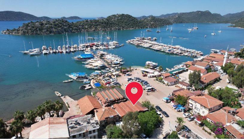 an aerial view of a marina with a red marker at Gonul Pansiyon in Kaleucagız