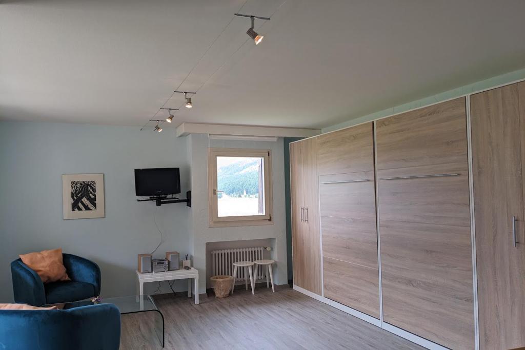 TV a/nebo společenská místnost v ubytování Residenza Lagrev 2 Zimmerwohnung Nr 122 - Typ 21A - 1 Etage - Süd