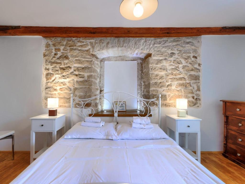 Postel nebo postele na pokoji v ubytování Holiday Home Pinia II by Interhome