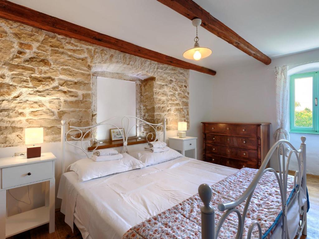 Postel nebo postele na pokoji v ubytování Holiday Home Pinia II by Interhome
