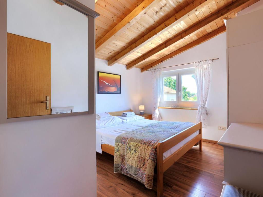 Łóżko lub łóżka w pokoju w obiekcie Holiday Home Pinia I by Interhome