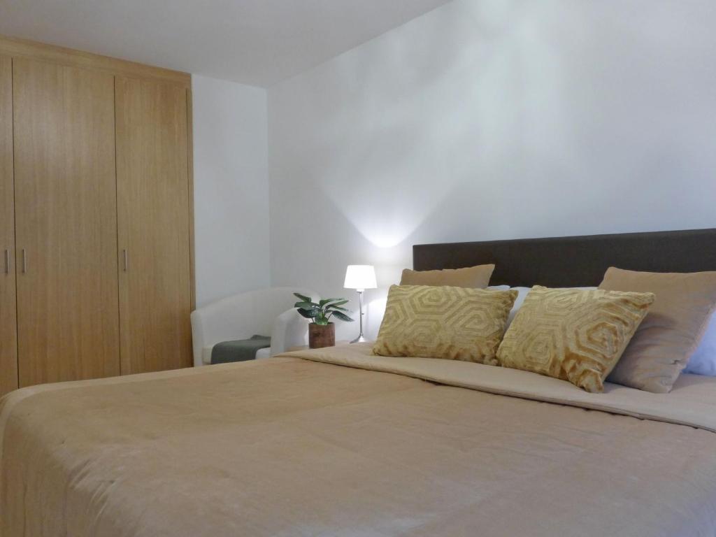 Postel nebo postele na pokoji v ubytování Apartment Panoramapark Soleil Haus D Apt 3 by Interhome