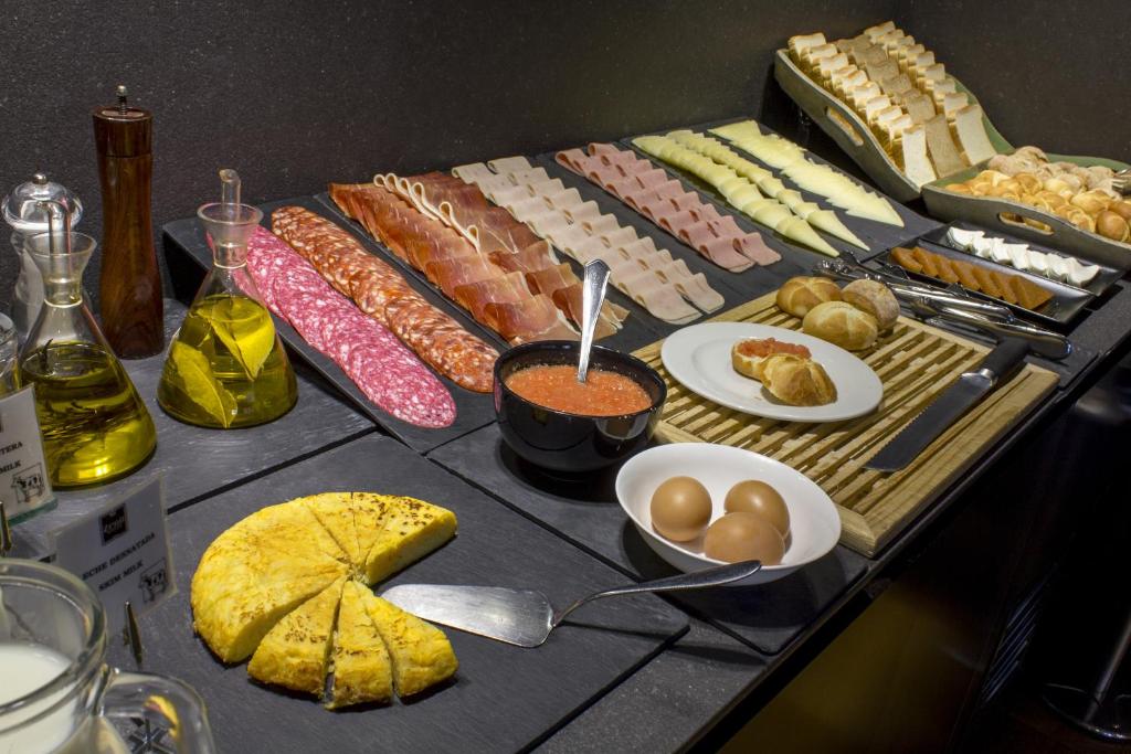 a table filled with different types of food on it at Zenit Vigo in Vigo