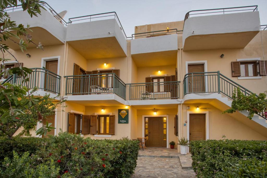 an apartment building with balconies and a courtyard at Bellino Apartments "Adults Only" in Hersonissos