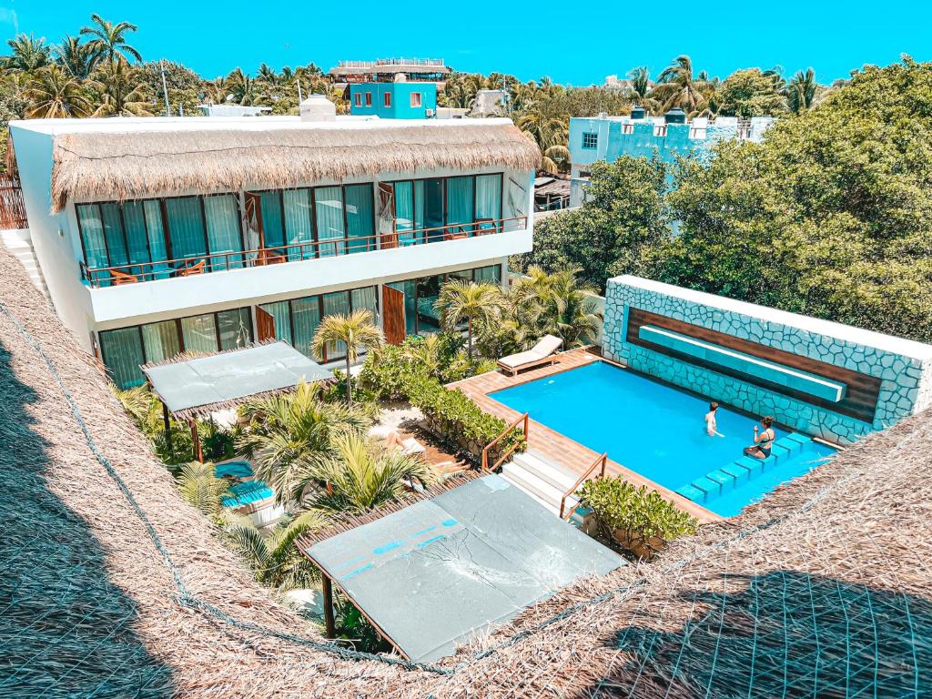 an aerial view of a house with a swimming pool at Hotel Boutique Naj Casa Holbox in Holbox Island