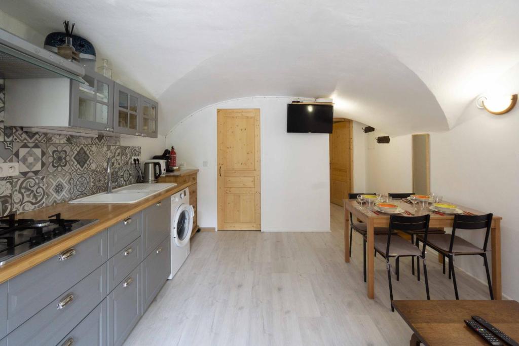 Kuchyňa alebo kuchynka v ubytovaní Charmant appartement 3 etoiles