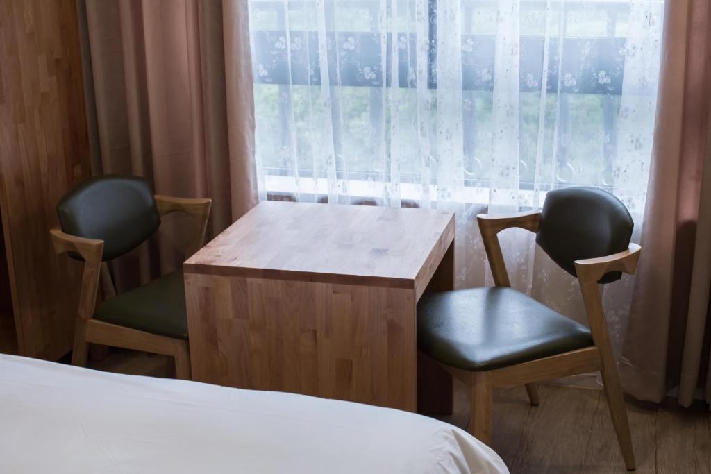 Postel nebo postele na pokoji v ubytování Elin Hotel