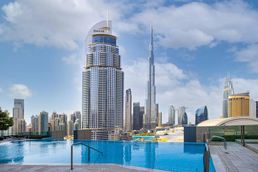 a view of a city skyline with a large building at Cozy 1Bed Connected to DubaiMall BurjKhalifa 5min in Dubai