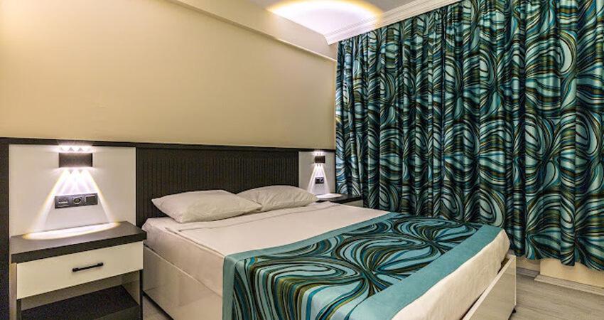 Postel nebo postele na pokoji v ubytování MERYAM SÜİT DELUXE