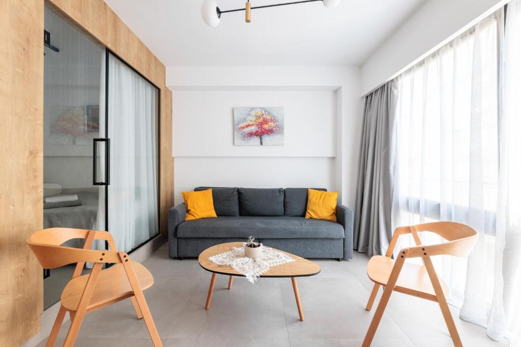 a living room with a couch and a table at SKG Urban Boutique in Thessaloniki