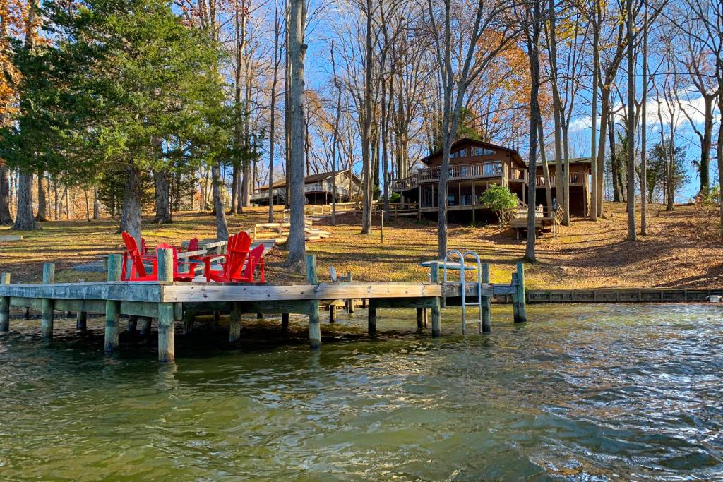 a dock with chairs sitting on top of a body of water at Life is Good in Mineral