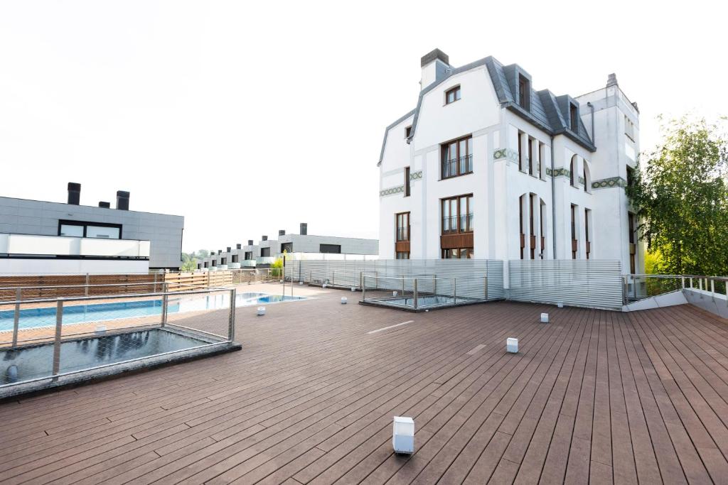 a large white building with a pool in front of it at Guadalupe by Basquelidays in Hondarribia