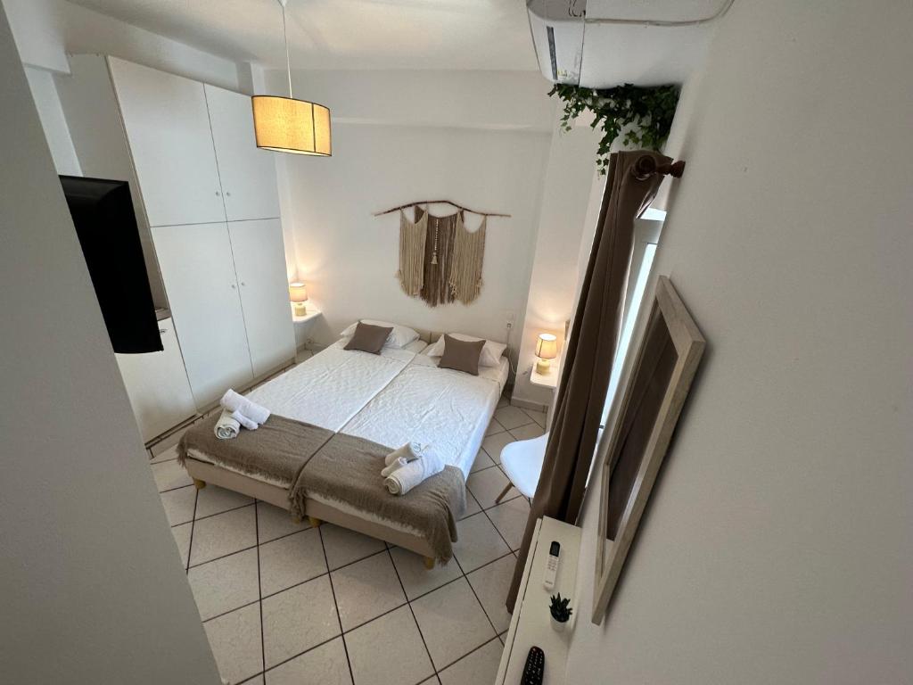 a bedroom with a bed and a tv in a room at Valente Rooms Kythira in Kythira