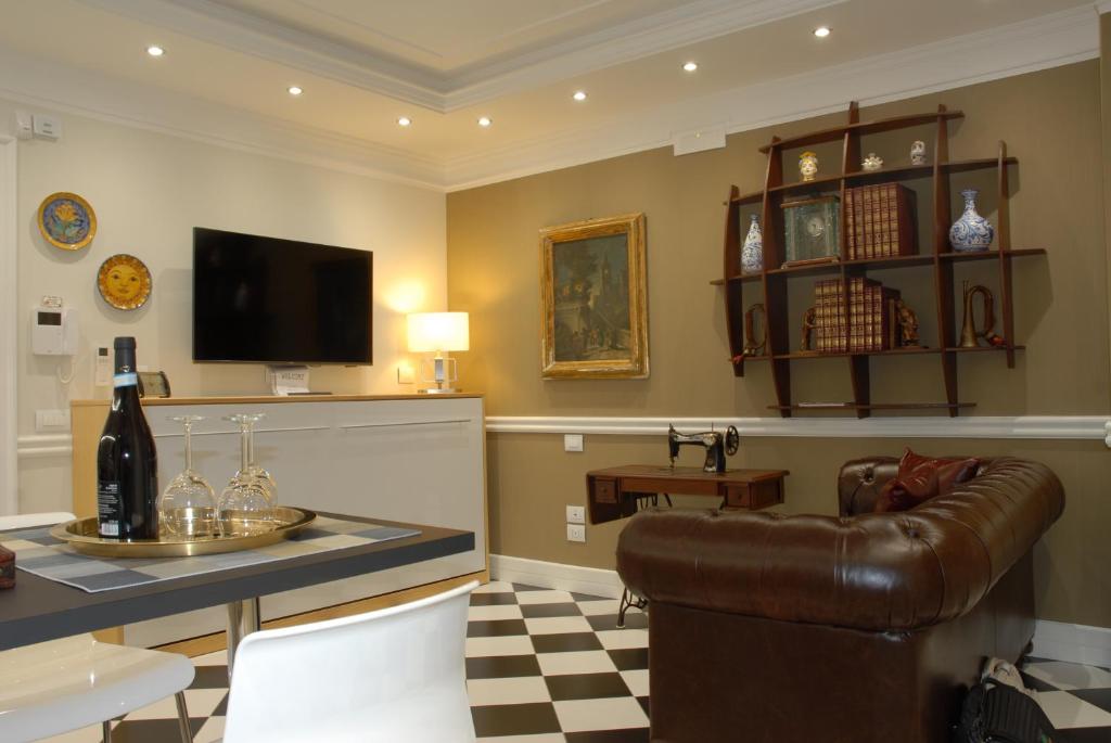 a living room with a couch and a table at Borgo Santa Caterina in Catania