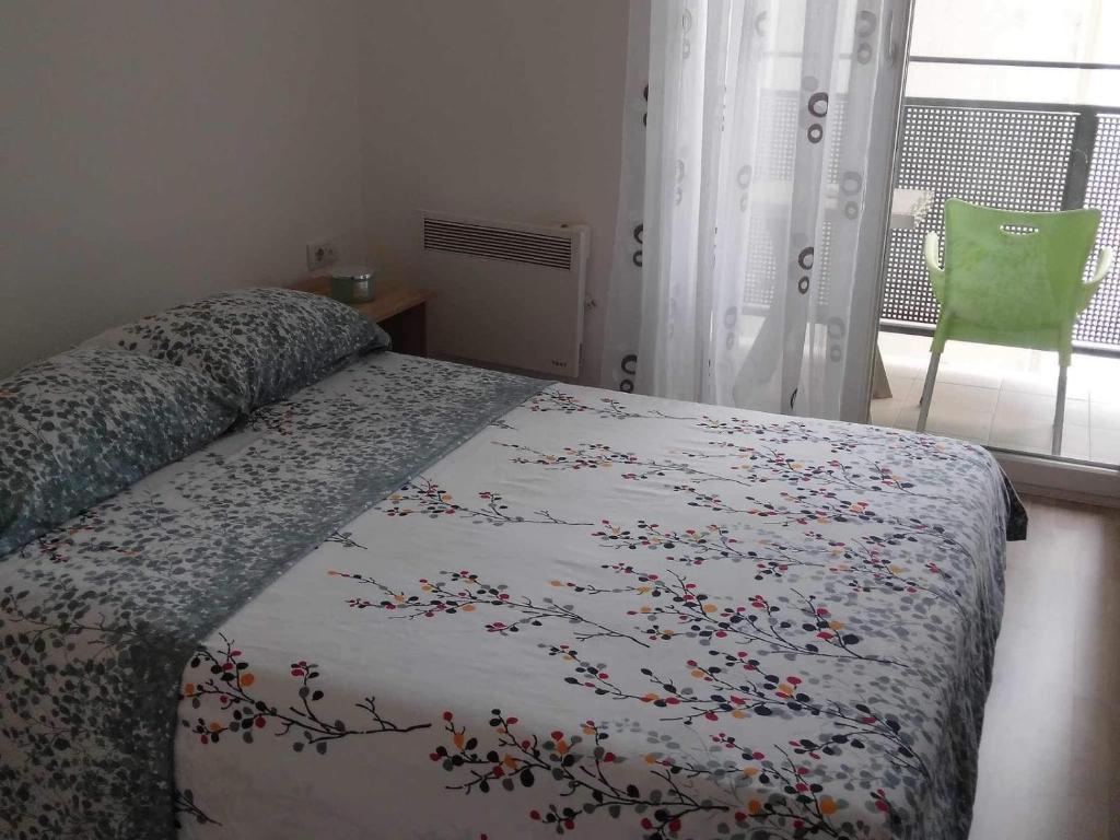 Postel nebo postele na pokoji v ubytování Green Apartman