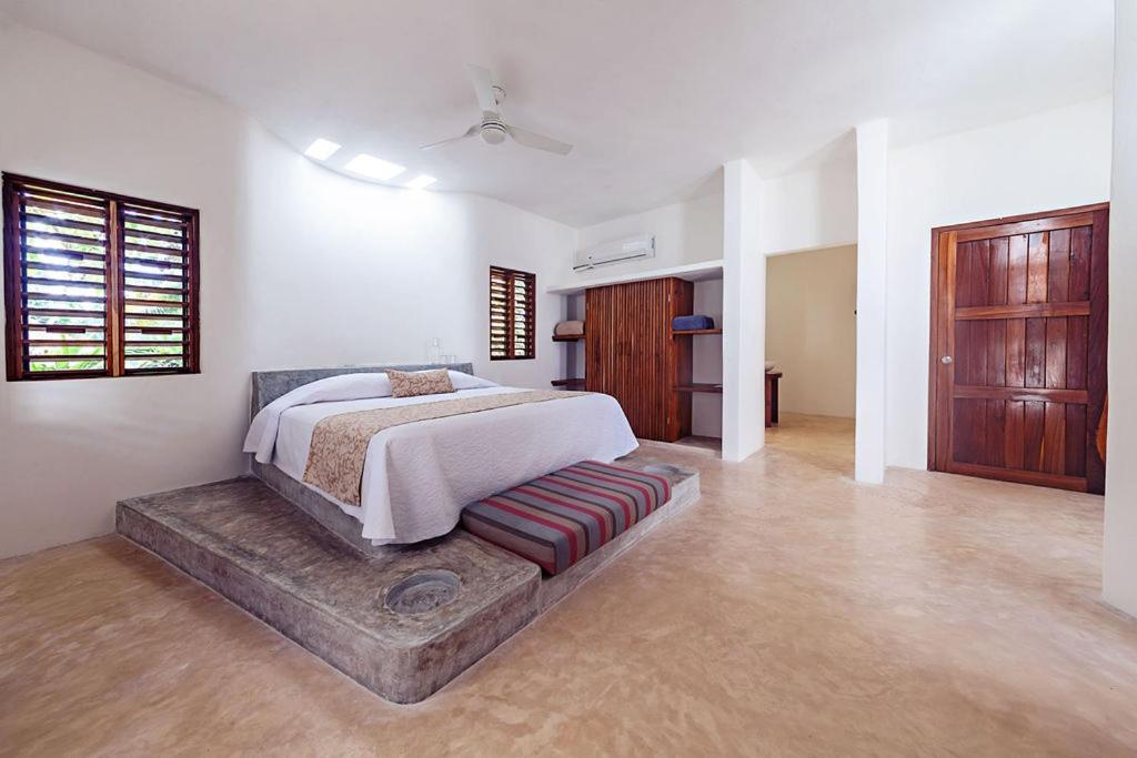 Postel nebo postele na pokoji v ubytování Mi Kasa Tu Kasa Bacalar by Nah Hotels