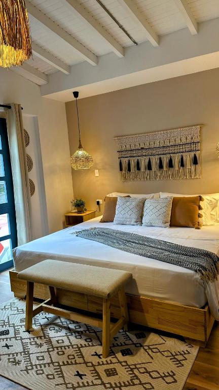 Postel nebo postele na pokoji v ubytování Poblado Luum Boutique hotel