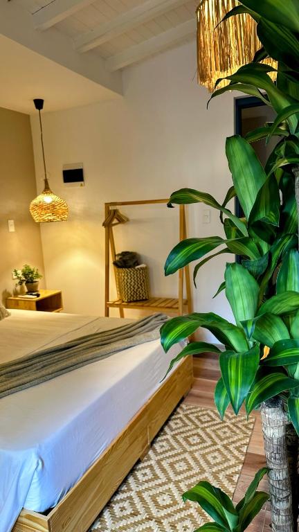 Postel nebo postele na pokoji v ubytování Poblado Luum Boutique hotel