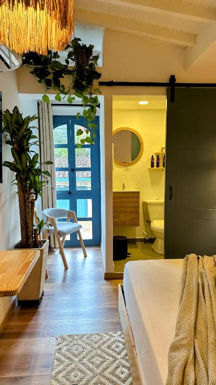 Postel nebo postele na pokoji v ubytování Poblado Luum Boutique hotel
