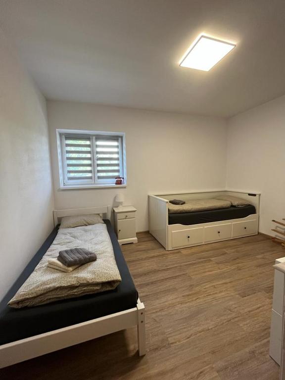 Postel nebo postele na pokoji v ubytování Apartmány Tobias