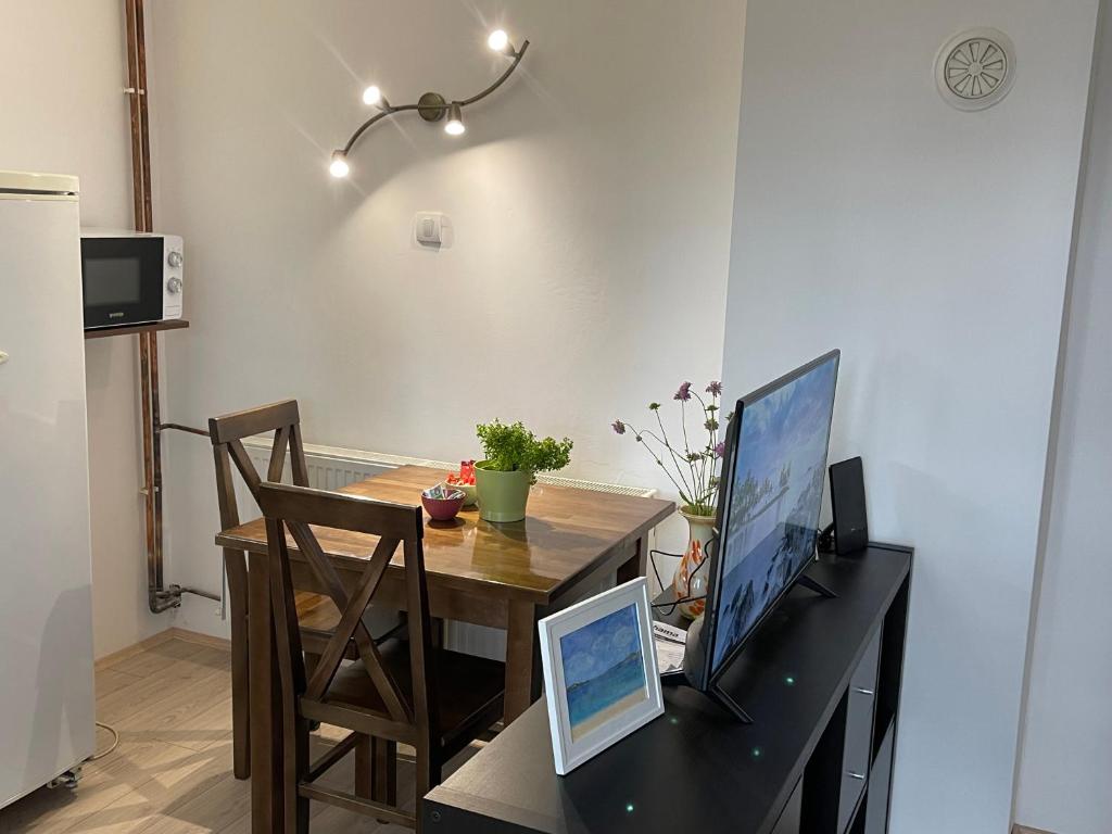 a kitchen with a desk with a computer on it at Smeštaj Nedić Karaula in Zlatibor