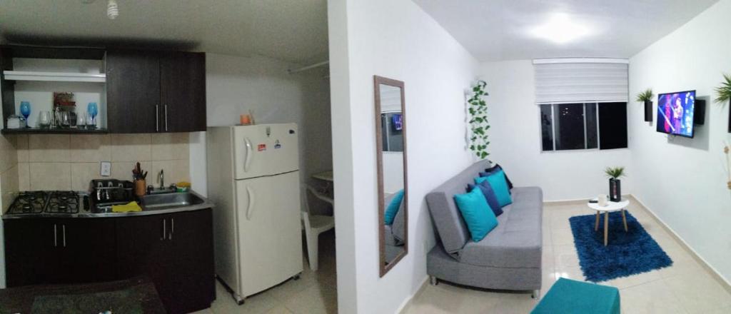 A cozinha ou cozinha compacta de Apartamentos por 3 noches parque del café