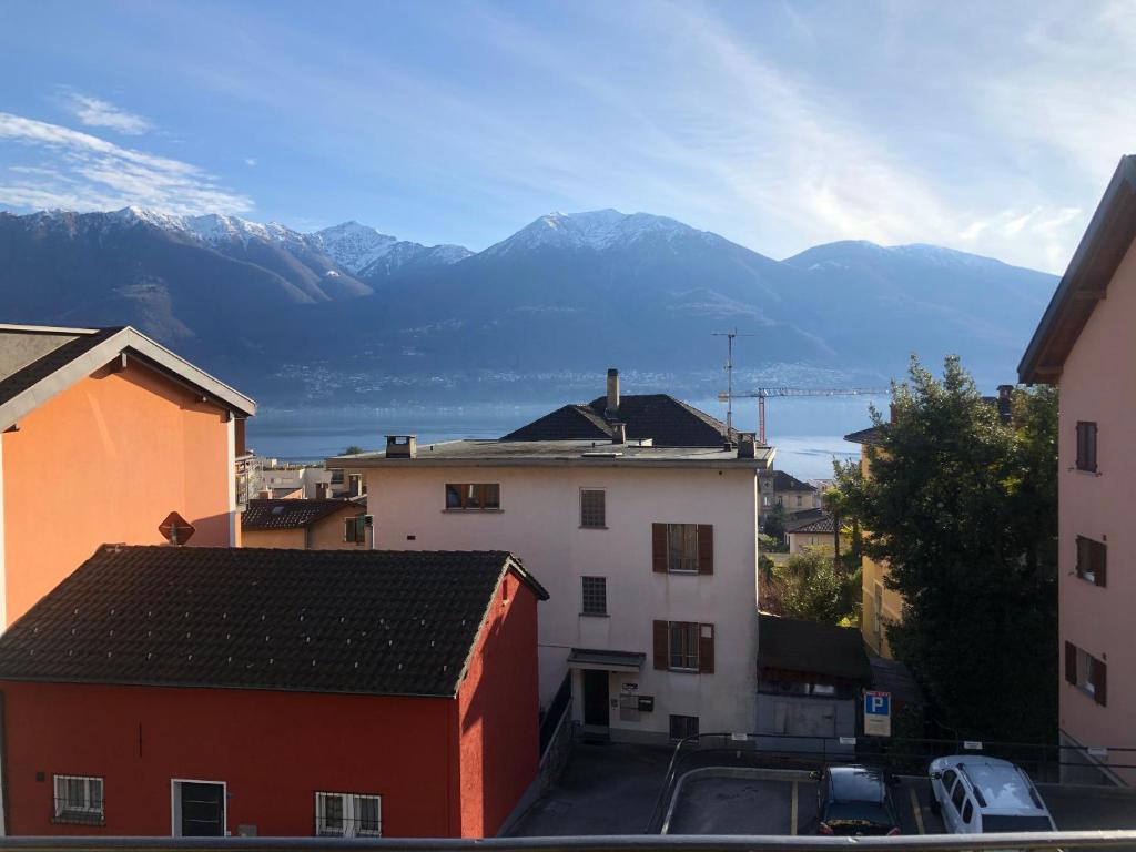 a view of a city with mountains in the background at Pensione Solaria in Locarno