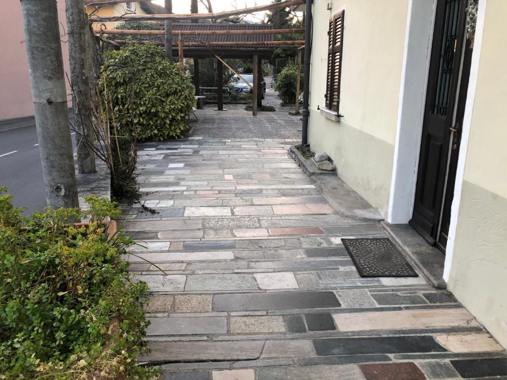 a stone walkway next to a building at Pensione Solaria in Locarno