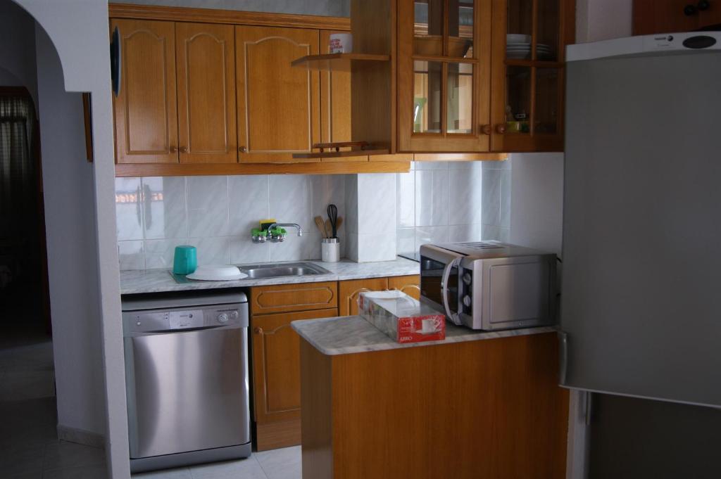 Kuchyň nebo kuchyňský kout v ubytování Apartamentos Playa Cargador
