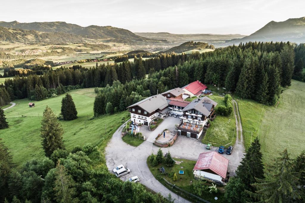 an aerial view of a house on a hill at Berghotel Sonnenklause in Sonthofen