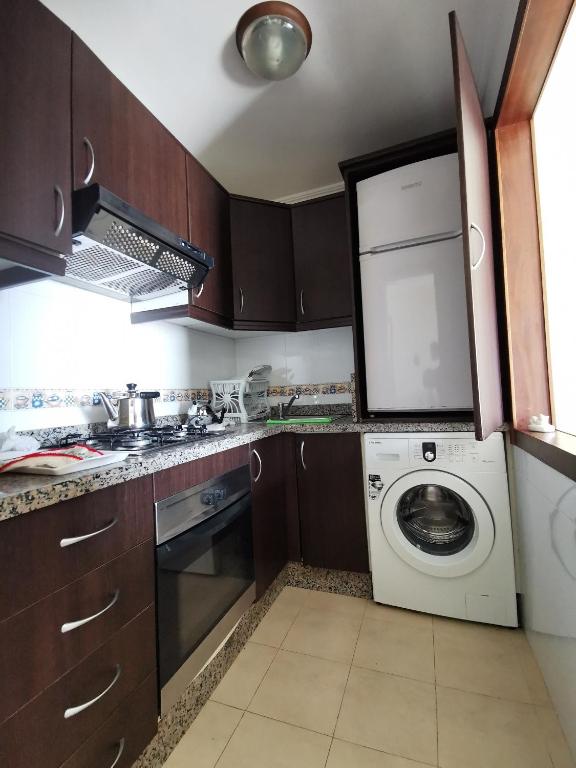 Kuchyň nebo kuchyňský kout v ubytování Appartement vue panoramique sur mer à BELLA VISTA