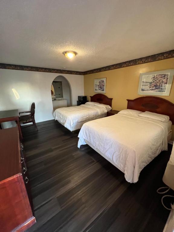 Postel nebo postele na pokoji v ubytování Royal Inn - Neptune