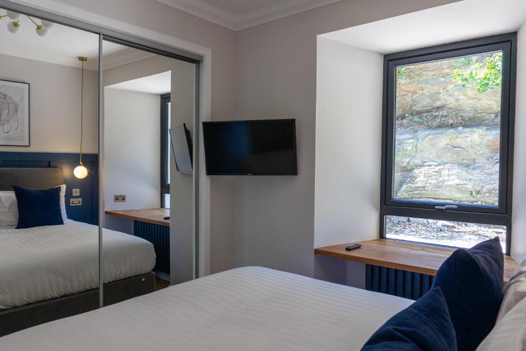 Postel nebo postele na pokoji v ubytování Oban Apartments