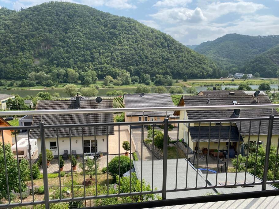 a view of a building with mountains in the background at Ferienwohnung Moseltraum in Müden