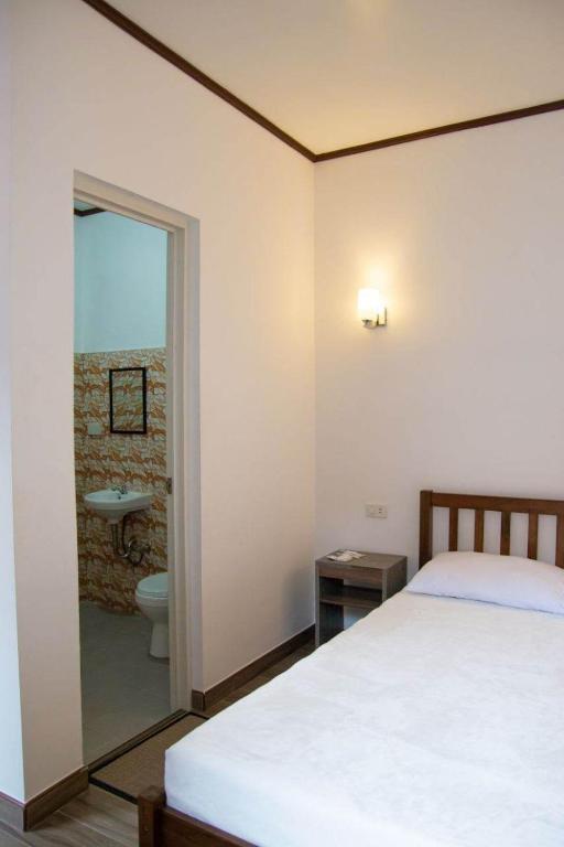 Postel nebo postele na pokoji v ubytování CASA MIA INN
