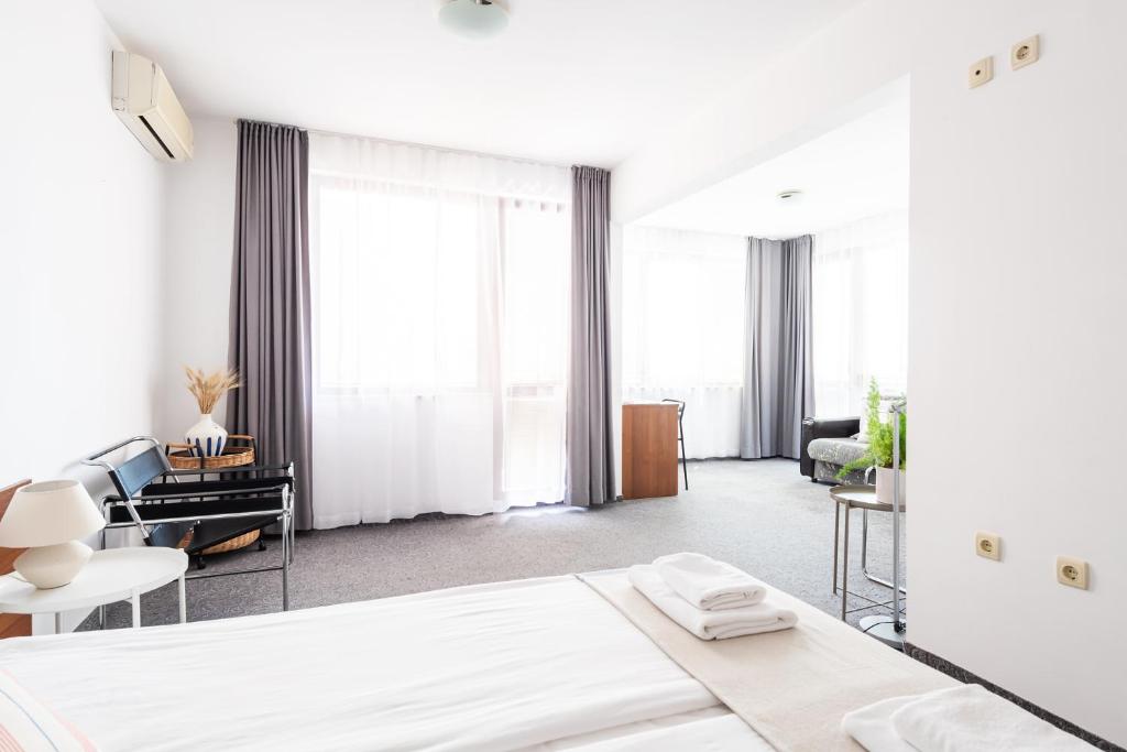 Postel nebo postele na pokoji v ubytování Sea House Afrodita II