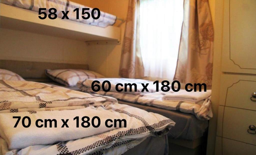 Posteľ alebo postele v izbe v ubytovaní Noclegi u Jagny