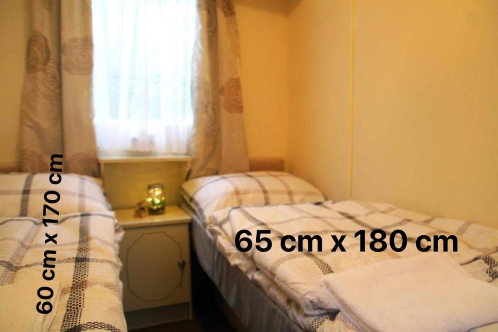 Posteľ alebo postele v izbe v ubytovaní Noclegi u Jagny