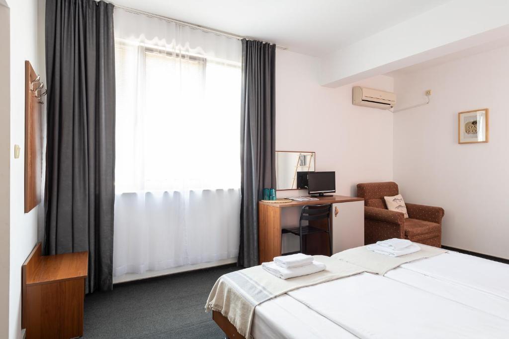 Postel nebo postele na pokoji v ubytování Sea House Afrodita II