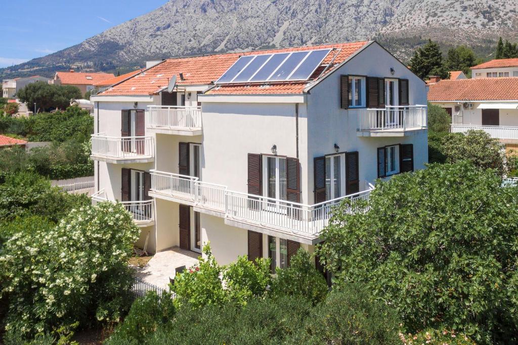 a house with solar panels on its roof at apartmani stefan in Orebić