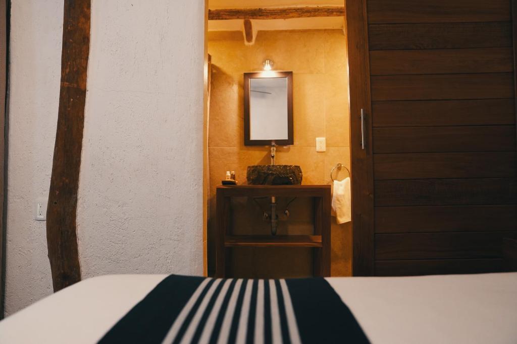 Postel nebo postele na pokoji v ubytování Bluebayou Bacalar